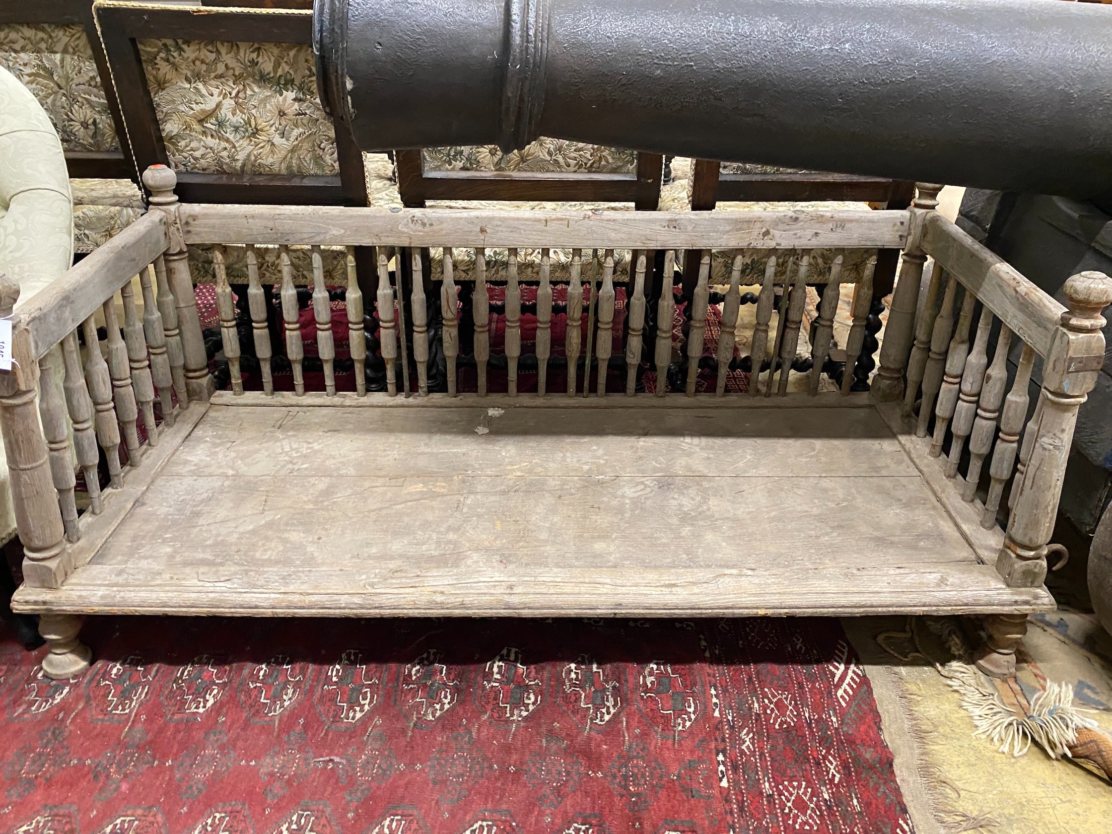 An Indonesian bleached wood low bench seat, length 142cm, depth 62cm, height 62cm